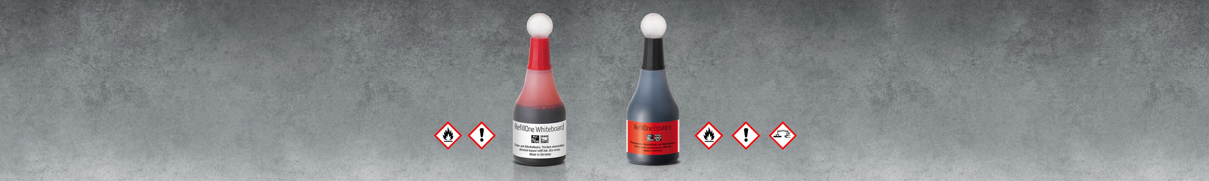 Nachfüllflaschen mit Gefahren-Kennzeichnung.